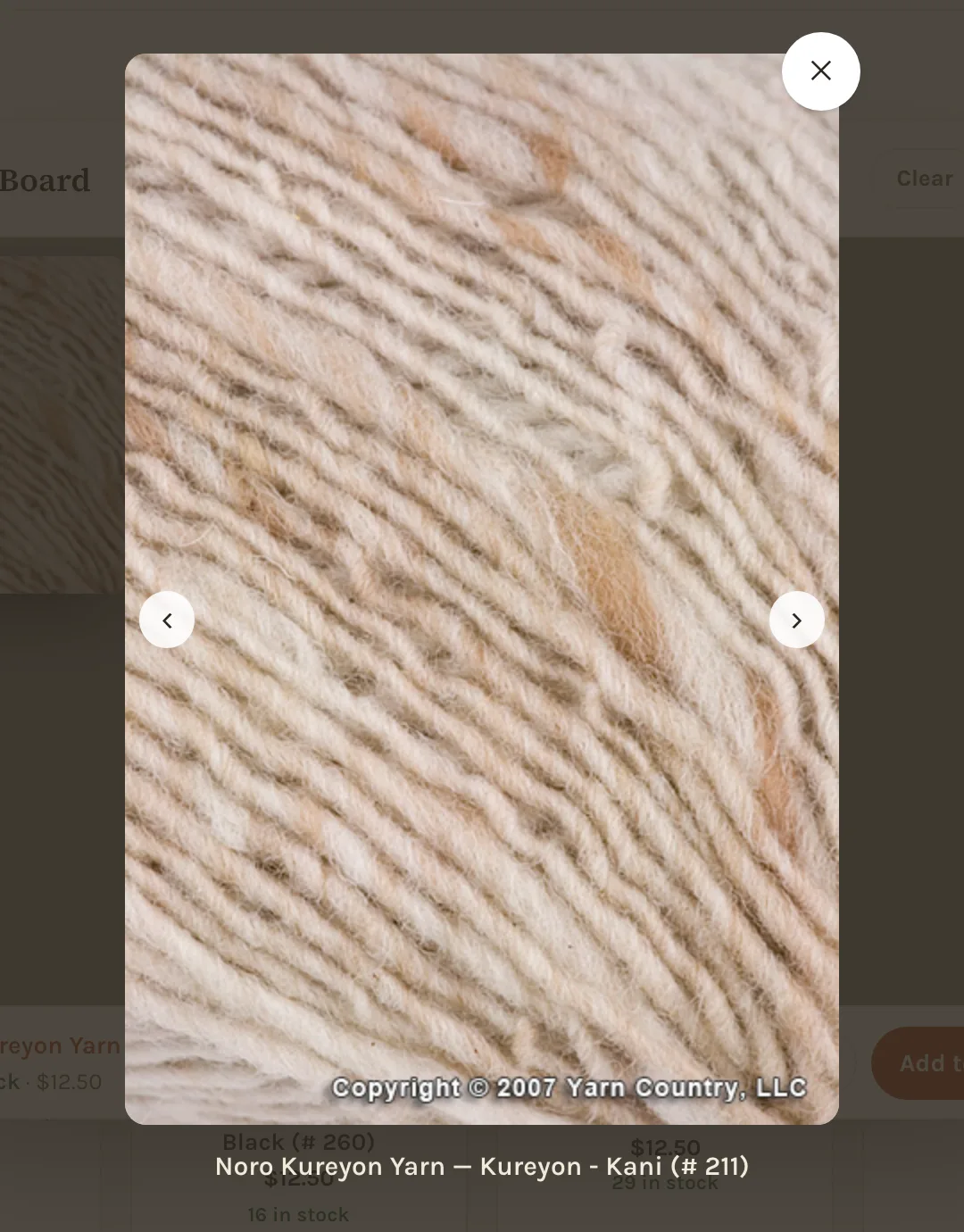 A skein photo shown large over the dimmed page, with arrows to either side and the color's name beneath